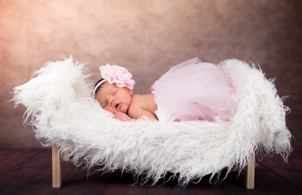 Newborn babygirl photoshoot sleeping in ballerina dress
