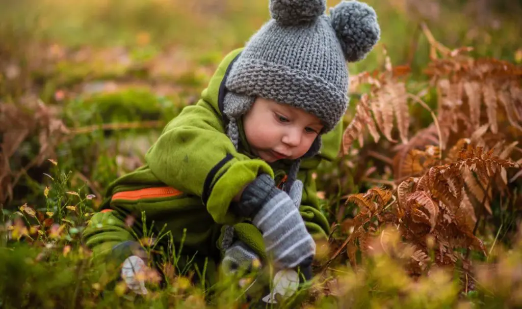 Baby photoshoot on green grass field
